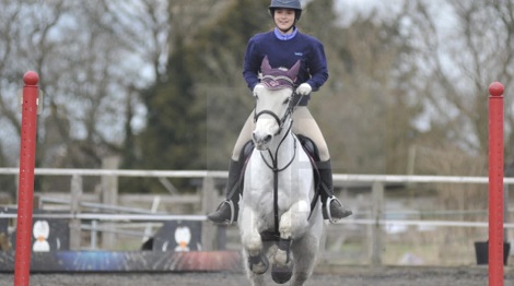 Girl jumping horse at Wapley stables